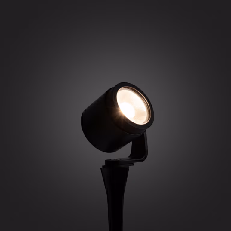Brandende In-lite Scope spot met warm licht op donkere achtergrond
