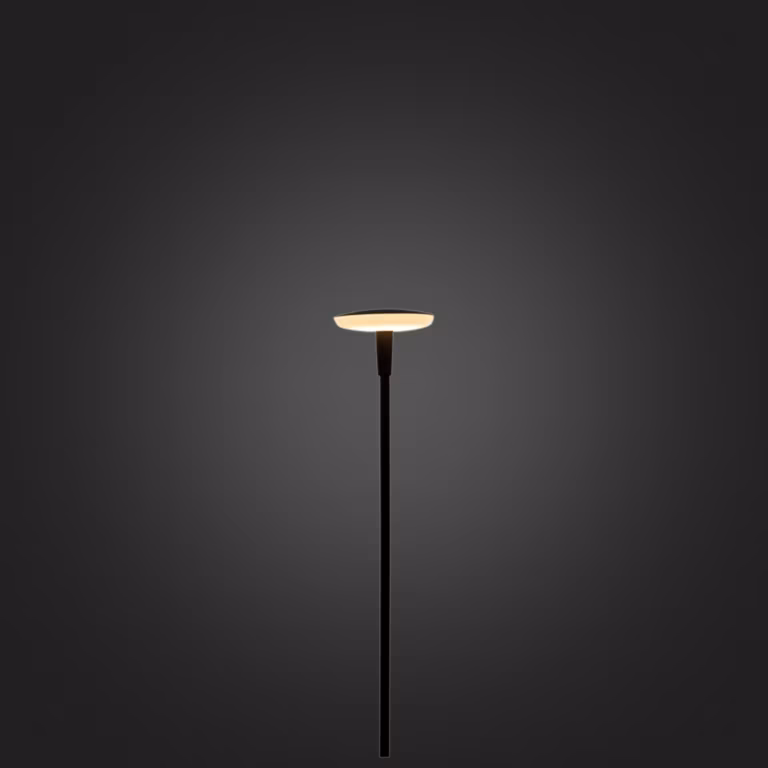 In-lite Sway Tube lamp brandend met warm licht in de platte kop tegen donkere achtergrond