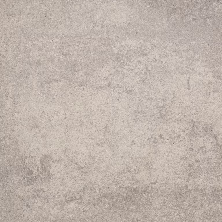Detail van gemêleerde beige betontegel Trippel T Beige Nuance met lichte vlekken