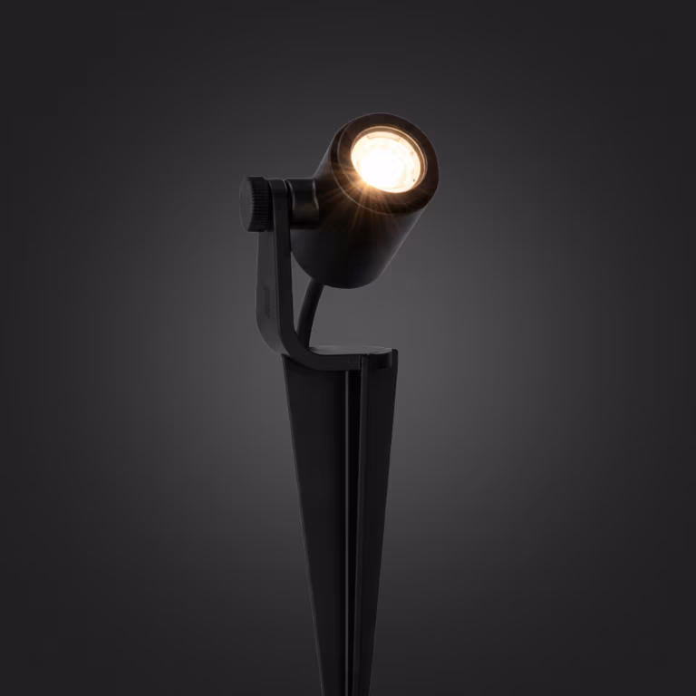 Brandende In-lite Micro Scope spot met warm licht op donkere achtergrond