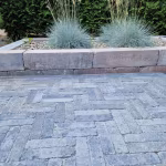 Stonique trommel waalformaat 7 cm Grijs_Zwart tuinpad