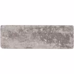 Losse WG Stone Trommelsteen 21x7x8 Taupe, bovenaanzicht met grijze vlekken op wit